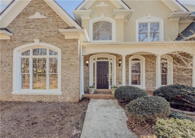 entrance to property with brick siding