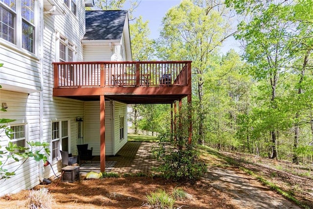 exterior space with a deck and central AC unit