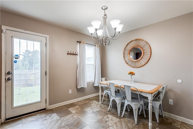 1574 Leonard St, Hampton, GA 30228 - dining space featuring a chandelier and baseboards