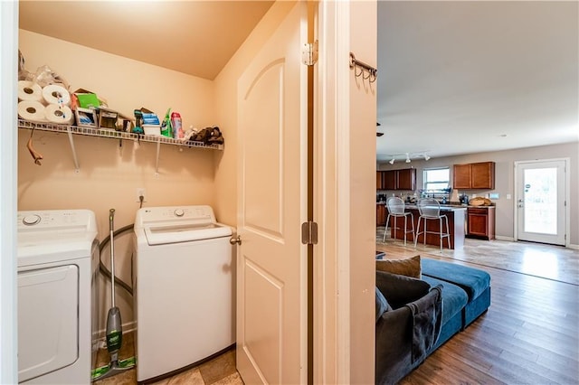 1574 Leonard St, Hampton, GA 30228 - laundry area with independent washer and dryer and light wood-style floors