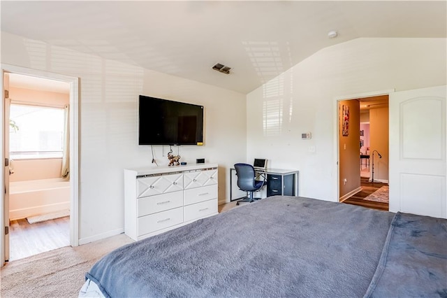 1574 Leonard St, Hampton, GA 30228 - bedroom with vaulted ceiling, carpet flooring, a desk, and ensuite bathroom