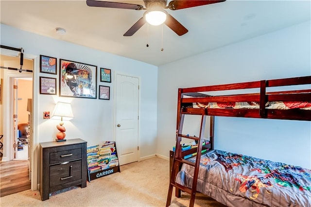 1574 Leonard St, Hampton, GA 30228 - carpeted bedroom featuring a barn door and a ceiling fan