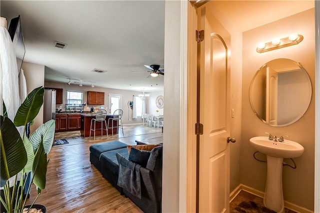 1574 Leonard St, Hampton, GA 30228 - bathroom featuring a ceiling fan and wood finished floors
