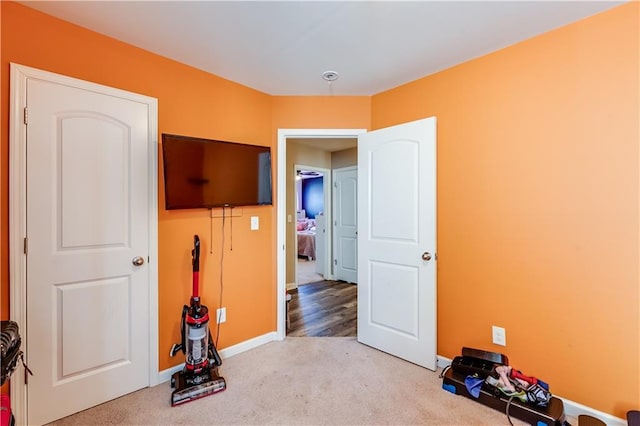 1574 Leonard St, Hampton, GA 30228 - unfurnished bedroom featuring light carpet and baseboards