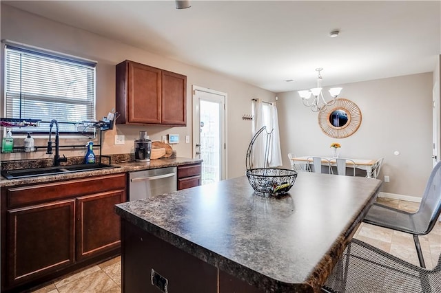 1574 Leonard St, Hampton, GA 30228 - kitchen with dark countertops, stainless steel dishwasher, a chandelier, and healthy amount of natural light