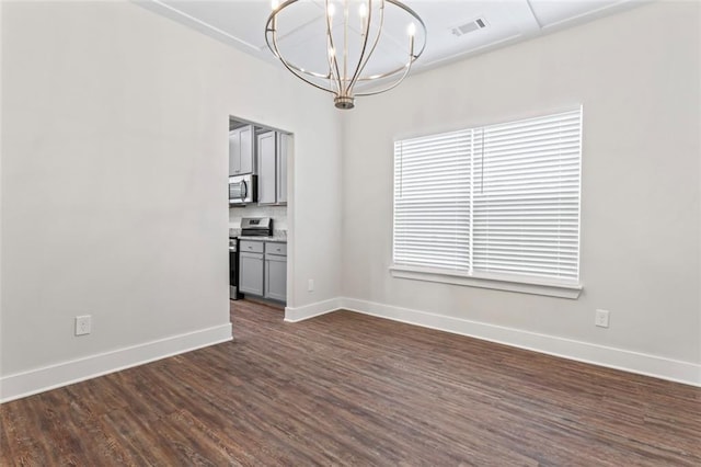 unfurnished dining area with visible vents, baseboards, dark wood-type flooring, and a chandelier