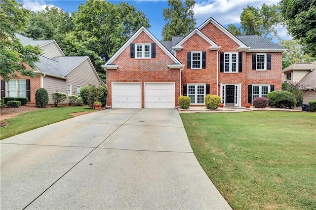 view of front of house featuring a garage and a front yard