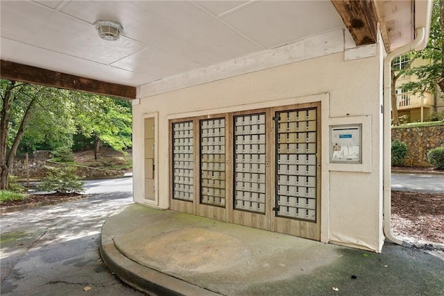 view of exterior entry with stucco siding