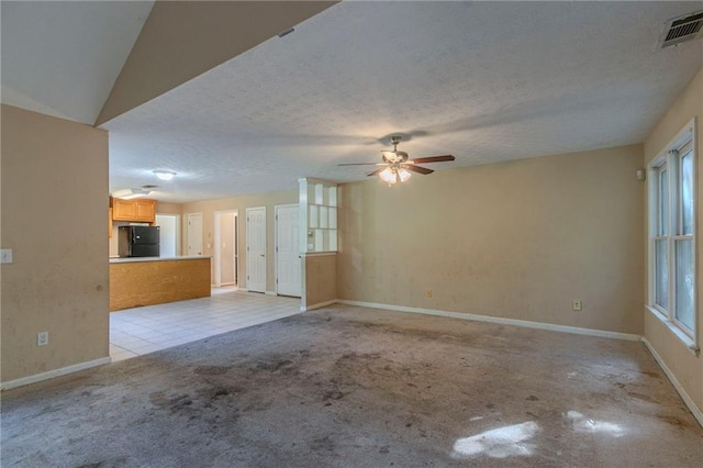 1615 Burnt Oak Way, Dacula, GA 30019 - unfurnished living room featuring a ceiling fan, light colored carpet, and a textured ceiling
