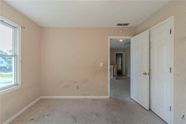 1615 Burnt Oak Way, Dacula, GA 30019 - unfurnished bedroom featuring multiple windows and carpet flooring
