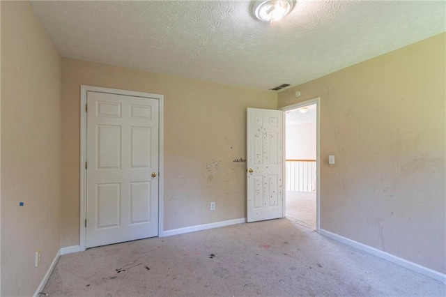 1615 Burnt Oak Way, Dacula, GA 30019 - unfurnished bedroom featuring carpet flooring and a textured ceiling