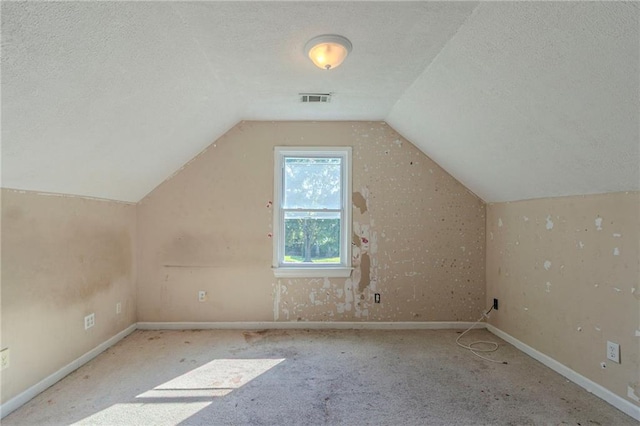 1615 Burnt Oak Way, Dacula, GA 30019 - additional living space with a textured ceiling, lofted ceiling, and carpet flooring