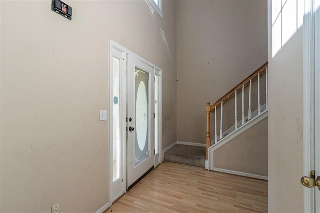 1615 Burnt Oak Way, Dacula, GA 30019 - entrance foyer featuring stairway, light wood-type flooring, and a high ceiling