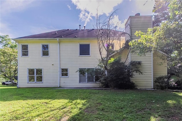 1615 Burnt Oak Way, Dacula, GA 30019 - back of house with a yard and a chimney
