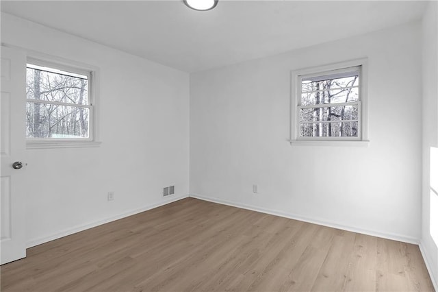 unfurnished room featuring light wood-type flooring