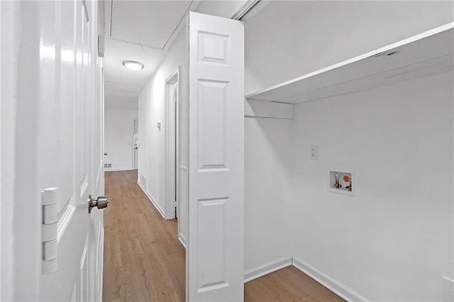 washroom featuring light wood-type flooring and hookup for a washing machine