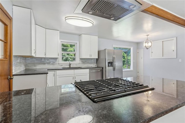 128 Mountain View Dr, Gainesville, GA 30501 - kitchen with appliances with stainless steel finishes, a sink, ventilation hood, and plenty of natural light