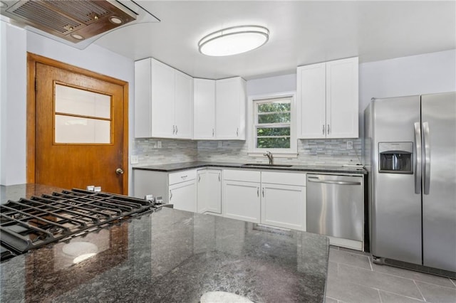 128 Mountain View Dr, Gainesville, GA 30501 - kitchen with appliances with stainless steel finishes, custom range hood, a sink, and tasteful backsplash