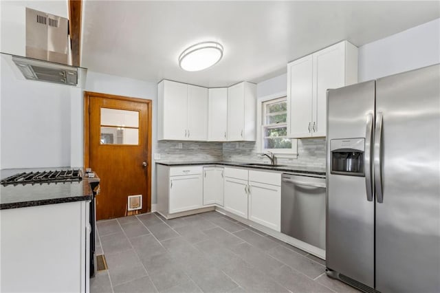 128 Mountain View Dr, Gainesville, GA 30501 - kitchen featuring stainless steel appliances, range hood, a sink, dark countertops, and backsplash