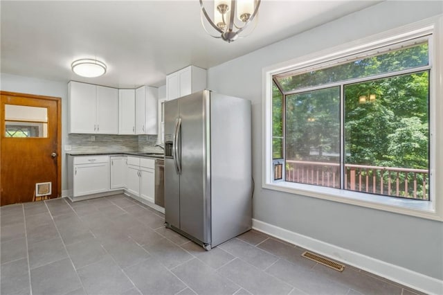 128 Mountain View Dr, Gainesville, GA 30501 - kitchen featuring appliances with stainless steel finishes, white cabinets, baseboards, and tasteful backsplash