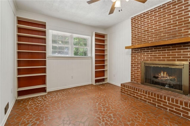 128 Mountain View Dr, Gainesville, GA 30501 - unfurnished living room with a textured ceiling, baseboards, a ceiling fan, a fireplace, and wooden walls