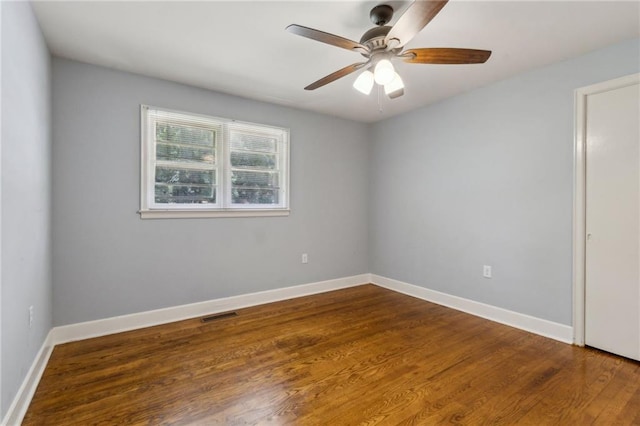 128 Mountain View Dr, Gainesville, GA 30501 - empty room with dark wood-style flooring, a ceiling fan, and baseboards
