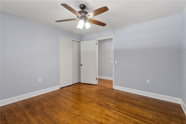 128 Mountain View Dr, Gainesville, GA 30501 - unfurnished bedroom with baseboards, a closet, wood finished floors, and ceiling fan