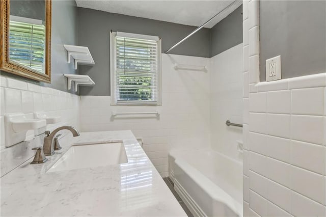 128 Mountain View Dr, Gainesville, GA 30501 - bathroom featuring tile walls, shower / tub combination, vanity, and wainscoting
