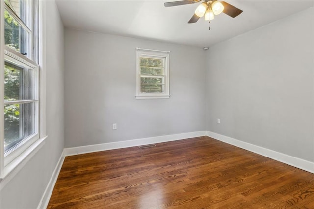 128 Mountain View Dr, Gainesville, GA 30501 - empty room with dark wood-type flooring, ceiling fan, and baseboards