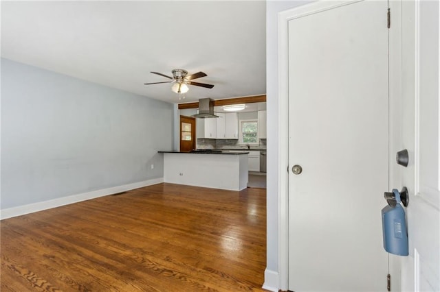 128 Mountain View Dr, Gainesville, GA 30501 - unfurnished living room with a ceiling fan, wood finished floors, and baseboards