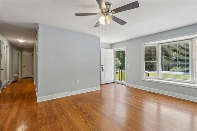 128 Mountain View Dr, Gainesville, GA 30501 - empty room with wood finished floors, baseboards, and ceiling fan