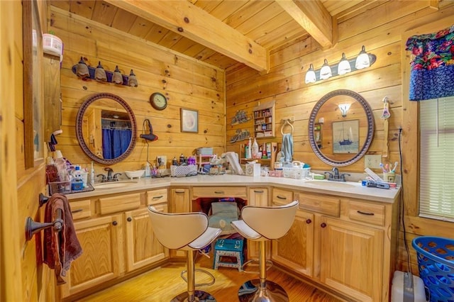 bathroom with vanity, wooden walls, hardwood / wood-style flooring, wooden ceiling, and beamed ceiling