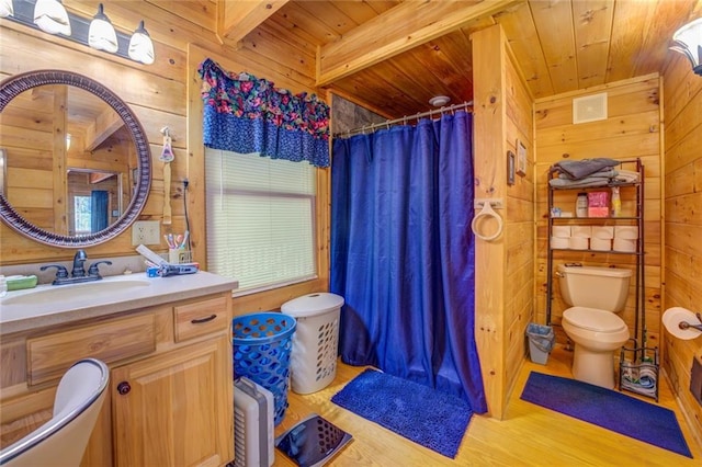 bathroom with beam ceiling, wooden walls, wood ceiling, and wood-type flooring