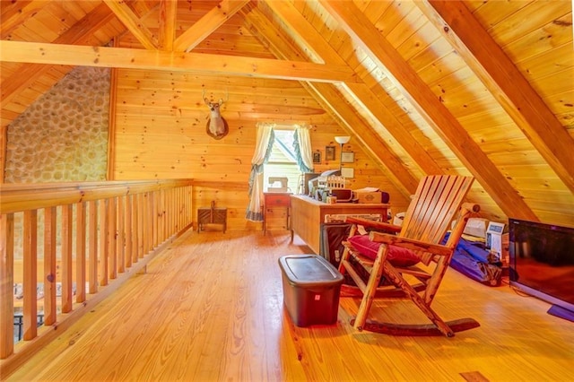 additional living space with wood ceiling, vaulted ceiling with beams, and light hardwood / wood-style floors