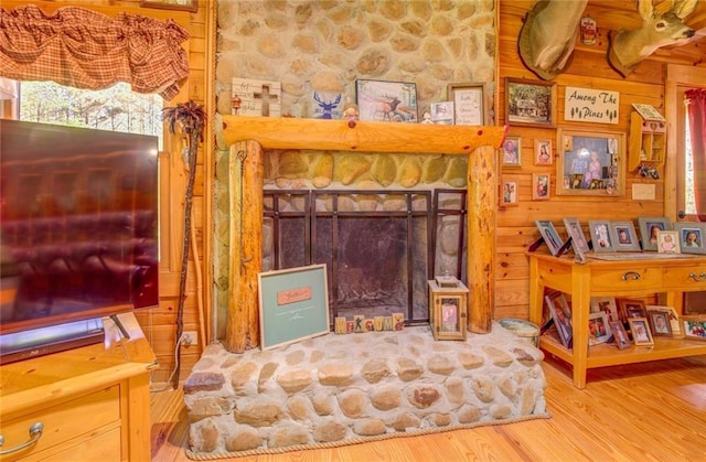 living room featuring a fireplace and hardwood / wood-style flooring