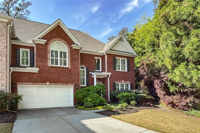 104 Glentown Way, Sandy Springs, GA 30328 - view of front of house with a garage, a shingled roof, driveway, and brick siding