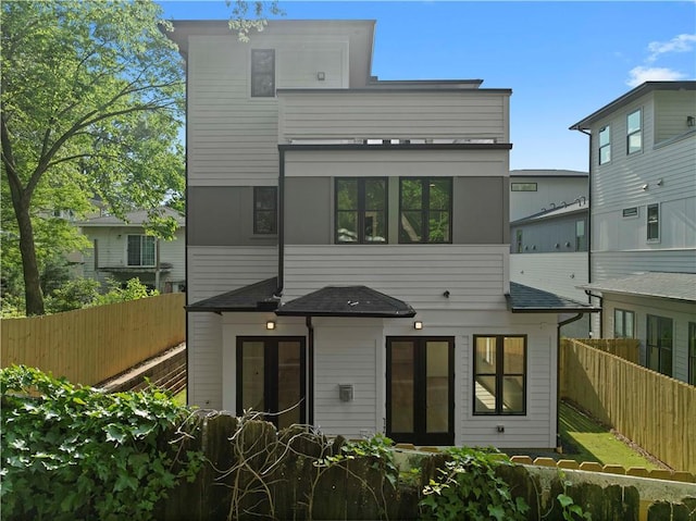 rear view of property featuring french doors