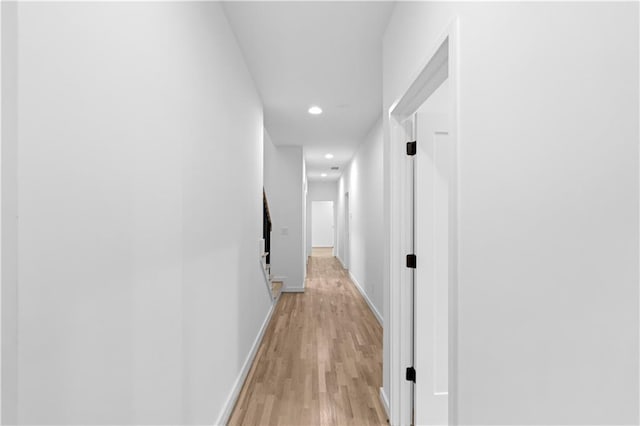 hall with light hardwood / wood-style floors