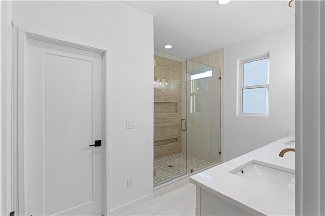 bathroom with vanity, tile patterned floors, and a shower with shower door