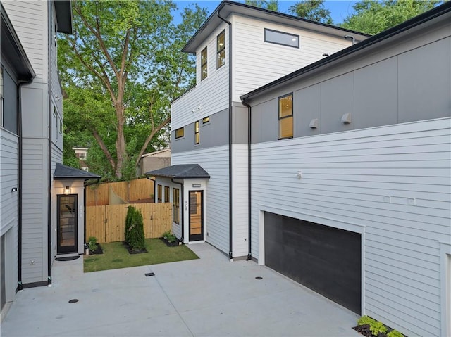 view of side of property with a garage