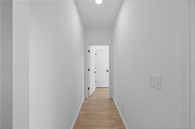 hall with light hardwood / wood-style floors