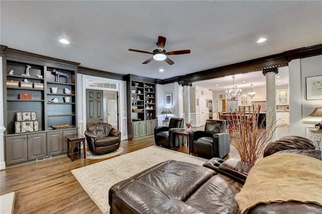 sunroom / solarium with decorative columns, ceiling fan, and lofted ceiling