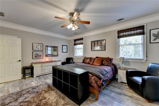 living area with hardwood / wood-style flooring, crown molding, and ceiling fan