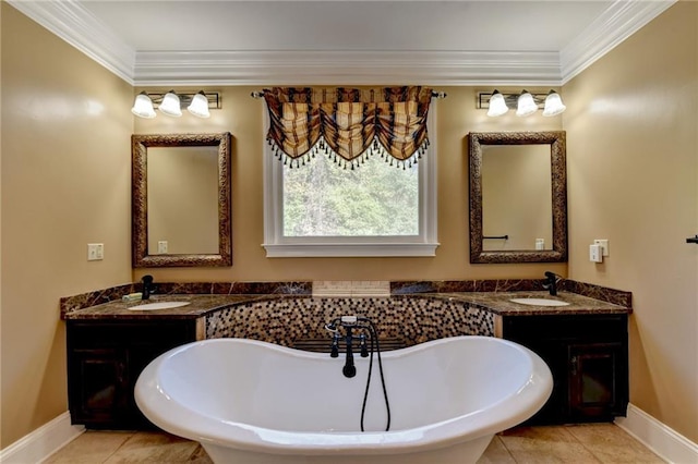 bathroom with a tub to relax in, vanity, and ornamental molding