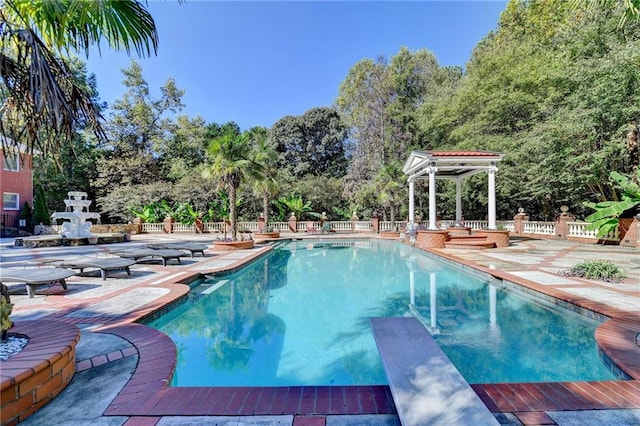 view of swimming pool with a patio area and a gazebo