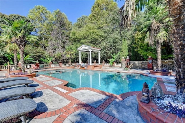 view of swimming pool featuring a patio area