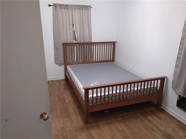 4076 Fairmont St, Gainesville, GA 30506 - bedroom featuring baseboards and wood finished floors