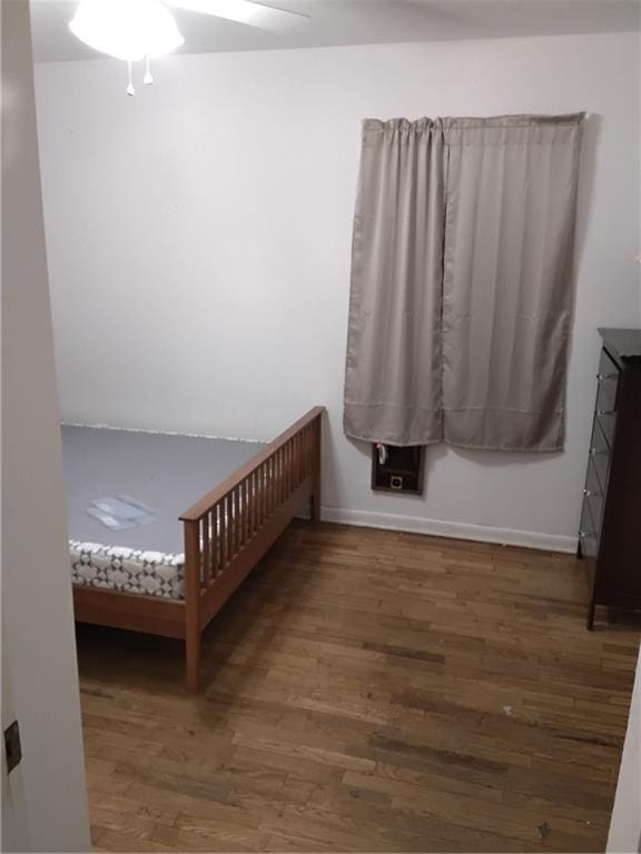 4076 Fairmont St, Gainesville, GA 30506 - bedroom featuring dark wood-style flooring, a ceiling fan, and baseboards