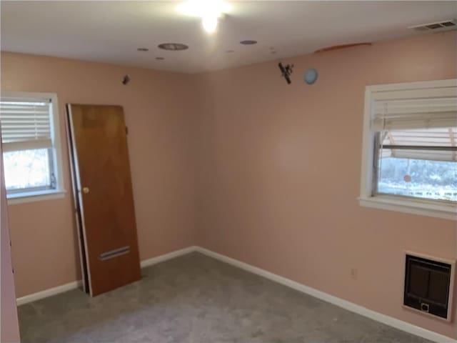 4076 Fairmont St, Gainesville, GA 30506 - unfurnished room with heating unit, visible vents, light carpet, and baseboards