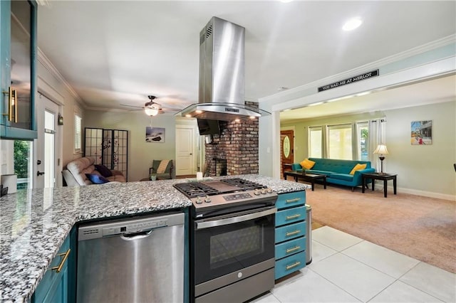 1192 Eastridge Rd SW, Atlanta, GA 30311 - kitchen featuring stainless steel appliances, island range hood, light colored carpet, and blue cabinets